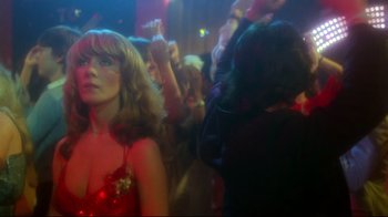 Movie still from “Prom Night” (1980), directed by Paul Lynch – A group of people in a room at a party; Close Up shot, Over the shoulder angle