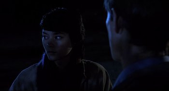Movie still from “Psycho II” (1983), directed by Richard Franklin – A woman and a man are talking in the dark; Close Up shot, Over the shoulder angle