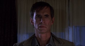 Movie still from “Psycho II” (1983), directed by Richard Franklin – A person wearing a jacket; Close Up shot, Low angle