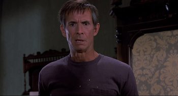 Movie still from “Psycho II” (1983), directed by Richard Franklin – A person wearing a purple t - shirt; Close Up shot, Low angle