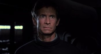 Movie still from “Psycho II” (1983), directed by Richard Franklin – A person wearing a black shirt; Close Up shot, Low angle