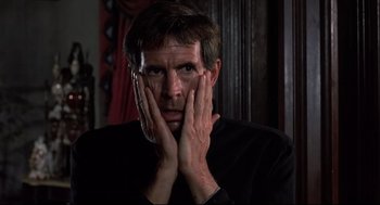 Movie still from “Psycho II” (1983), directed by Richard Franklin – A person with his hands near his face; Close Up shot, Low angle