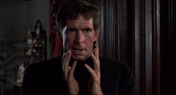 Movie still from “Psycho II” (1983), directed by Richard Franklin – A person with his hands on his face; Close Up shot, Low angle