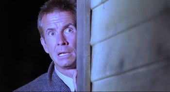Movie still from “Psycho III” (1986), directed by Anthony Perkins – A person with his mouth wide open; Close Up shot, Low angle