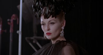 Movie still from “Puzzle of a Downfall Child” (1970), directed by Jerry Schatzberg – A person wearing a black dress; Close Up shot, Low angle