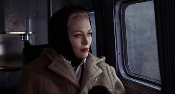 Movie still from “Puzzle of a Downfall Child” (1970), directed by Jerry Schatzberg – A woman sitting on a train looking out the window; Close Up shot, Low angle