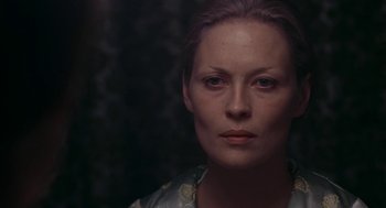 Movie still from “Puzzle of a Downfall Child” (1970), directed by Jerry Schatzberg – A person wearing a dress; Close Up shot, Over the shoulder angle