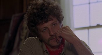 Movie still from “Puzzle of a Downfall Child” (1970), directed by Jerry Schatzberg – A person wearing a bandana; Close Up shot, Over the shoulder angle