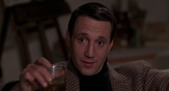 Movie still from “Puzzle of a Downfall Child” (1970), directed by Jerry Schatzberg – A person holding a glass of beer; Close Up shot, Low angle
