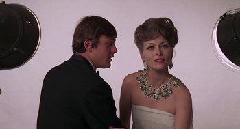 Movie still from “Puzzle of a Downfall Child” (1970), directed by Jerry Schatzberg – A man and a woman in formal attire; Close Up shot, Low angle