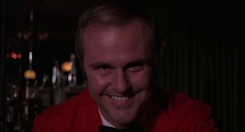 Movie still from “Puzzle of a Downfall Child” (1970), directed by Jerry Schatzberg – A person wearing a red jacket; Close Up shot, Low angle