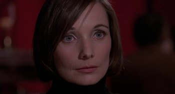 Movie still from “Puzzle of a Downfall Child” (1970), directed by Jerry Schatzberg – A person with short hair; Close Up shot, Over the shoulder angle