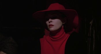 Movie still from “Puzzle of a Downfall Child” (1970), directed by Jerry Schatzberg – A woman wearing a red hat and a red scarf; Close Up shot, Low angle