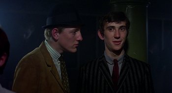 Movie still from “Quadrophenia” (1979), directed by Franc Roddam – Two men in suits and ties standing next to each other; Close Up shot, Low angle