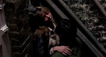 Movie still from “Quadrophenia” (1979), directed by Franc Roddam – A woman laying on top of another woman; Medium shot, Overhead angle