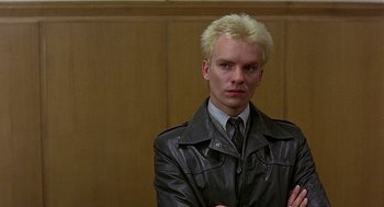 Movie still from “Quadrophenia” (1979), directed by Franc Roddam – A man with blonde hair and a leather jacket; Close Up shot, Low angle