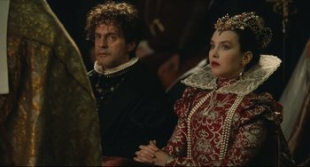 Movie still from “Queen Margot” (1994), directed by Patrice Chéreau – A man and a woman dressed in medieval clothing; Medium shot, Over the shoulder angle