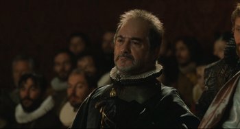 Movie still from “Queen Margot” (1994), directed by Patrice Chéreau – A person in a crowd; Close Up shot, Over the shoulder angle
