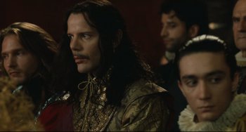 Movie still from “Queen Margot” (1994), directed by Patrice Chéreau – A person with long hair; Close Up shot, Over the shoulder angle