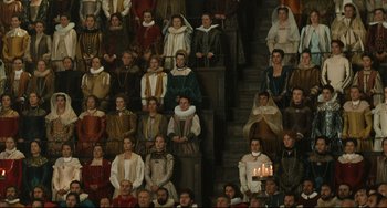 Movie still from “Queen Margot” (1994), directed by Patrice Chéreau – A group of people dressed in medieval clothing; Wide shot, High angle