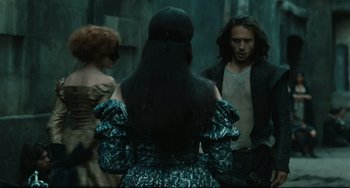 Movie still from “Queen Margot” (1994), directed by Patrice Chéreau – A group of people standing next to each other; Medium shot, Over the shoulder angle