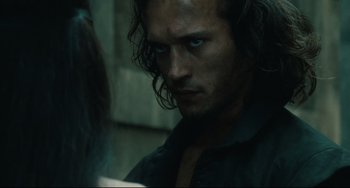 Movie still from “Queen Margot” (1994), directed by Patrice Chéreau – A person with long dark hair; Close Up shot, Over the shoulder angle