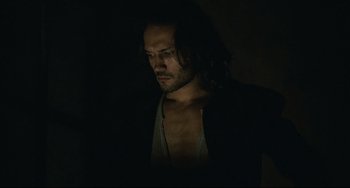 Movie still from “Queen Margot” (1994), directed by Patrice Chéreau – A person with long black hair; Close Up shot, Low angle