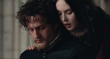 Movie still from “Queen Margot” (1994), directed by Patrice Chéreau – A man and a woman in a black and white photo; Close Up shot, Over the shoulder angle