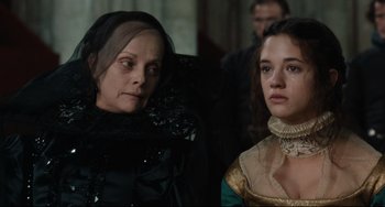 Movie still from “Queen Margot” (1994), directed by Patrice Chéreau – Two women sitting next to each other in a room; Close Up shot, Over the shoulder angle
