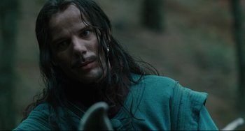 Movie still from “Queen Margot” (1994), directed by Patrice Chéreau – A person with long black hair; Close Up shot, Over the shoulder angle