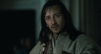 Movie still from “Queen Margot” (1994), directed by Patrice Chéreau – A person with long black hair; Close Up shot, Over the shoulder angle