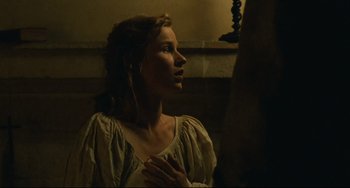 Movie still from “Queen Margot” (1994), directed by Patrice Chéreau – A beautiful woman with long brown hair wearing a white dress; Medium shot, High angle