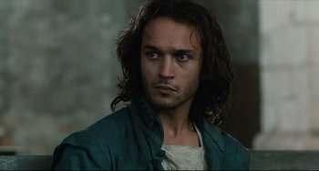 Movie still from “Queen Margot” (1994), directed by Patrice Chéreau – A person with long brown hair; Close Up shot, Over the shoulder angle