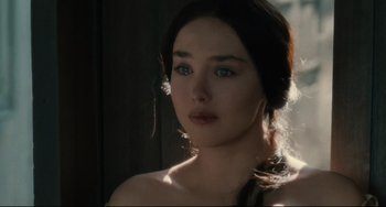 Movie still from “Queen Margot” (1994), directed by Patrice Chéreau – A beautiful young woman with blue eyes and long dark hair; Close Up shot, Over the shoulder angle