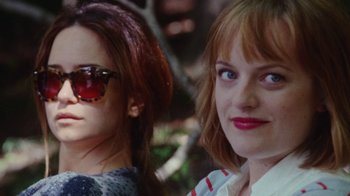 Movie still from “Queen of Earth” (2015), directed by Alex Ross Perry – Two women are standing next to each other; Close Up shot, Over the shoulder angle