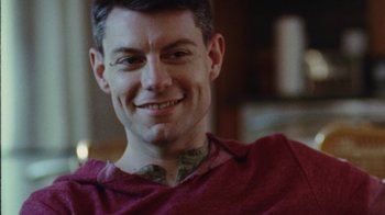 Movie still from “Queen of Earth” (2015), directed by Alex Ross Perry – A person wearing a red shirt; Close Up shot, Over the shoulder angle