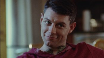 Movie still from “Queen of Earth” (2015), directed by Alex Ross Perry – A person wearing a red shirt; Close Up shot, Low angle