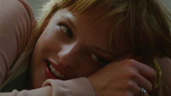 Movie still from “Queen of Earth” (2015), directed by Alex Ross Perry – A woman's face with her hand on her face; Extreme Close Up shot, Over the shoulder angle