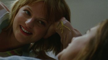 Movie still from “Queen of Earth” (2015), directed by Alex Ross Perry – A person holding their hand up to their ear; Close Up shot, Over the shoulder angle