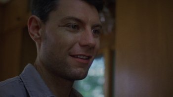 Movie still from “Queen of Earth” (2015), directed by Alex Ross Perry – A man's face in front of a window; Close Up shot, Low angle