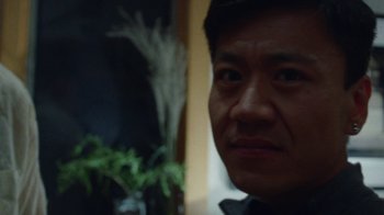 Movie still from “Queen of Earth” (2015), directed by Alex Ross Perry – A man's face with a plant in front of him; Extreme Close Up shot, Low angle
