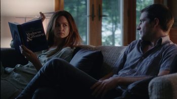 Movie still from “Queen of Earth” (2015), directed by Alex Ross Perry – A man and a woman sitting on a couch in front of a window; Medium shot, Over the shoulder angle