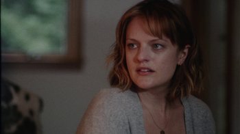 Movie still from “Queen of Earth” (2015), directed by Alex Ross Perry – A person wearing a sweater; Close Up shot, Over the shoulder angle