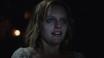 Movie still from “Queen of Earth” (2015), directed by Alex Ross Perry – A person wearing a white shirt; Close Up shot, Low angle