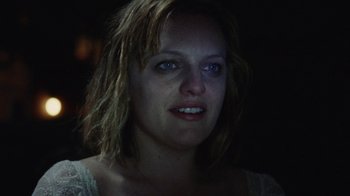 Movie still from “Queen of Earth” (2015), directed by Alex Ross Perry – A person wearing a white shirt; Close Up shot, Over the shoulder angle