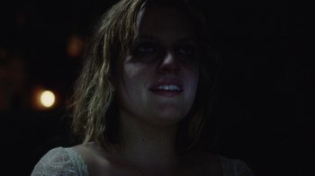 Movie still from “Queen of Earth” (2015), directed by Alex Ross Perry – A person wearing a white shirt; Close Up shot, Over the shoulder angle