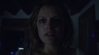 Movie still from “Queen of Earth” (2015), directed by Alex Ross Perry – A woman's face in the dark; Close Up shot, Low angle