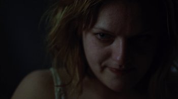 Movie still from “Queen of Earth” (2015), directed by Alex Ross Perry – A woman's face in the dark; Close Up shot, Low angle