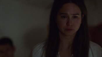 Movie still from “Queen of Earth” (2015), directed by Alex Ross Perry – A woman with long dark hair is looking at the camera; Close Up shot, High angle