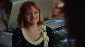 Movie still from “Queen of Earth” (2015), directed by Alex Ross Perry – A person smiling for the camera; Close Up shot, Over the shoulder angle